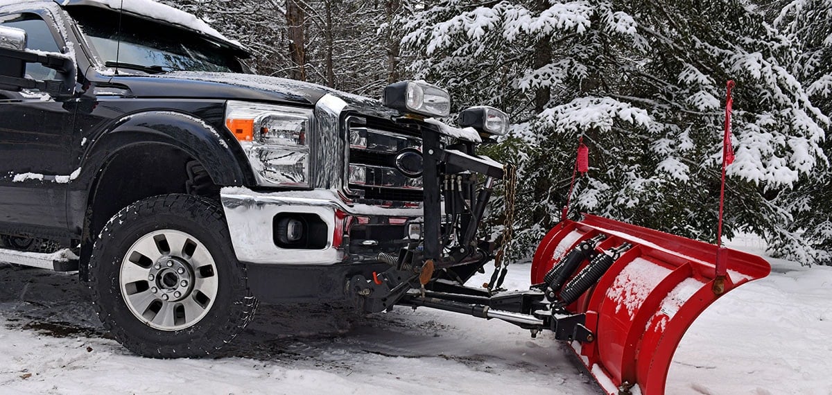 snow plow causing winter damage to parking lot