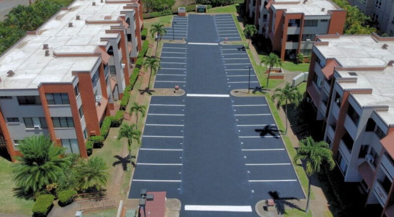 view of freshly sealcoated parking lot