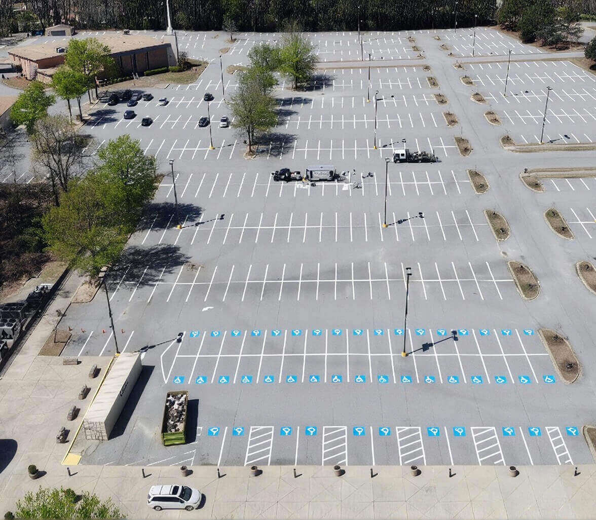 freshly striped church parking lot with ada signage