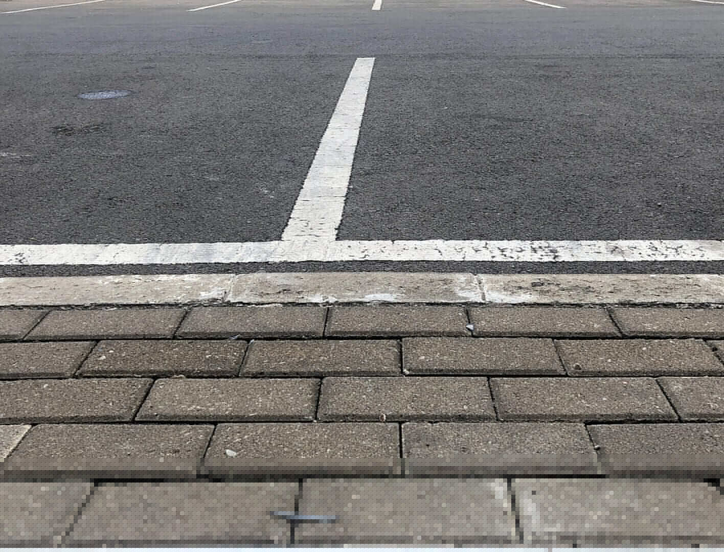 striped parking lot lines inside apartment complex