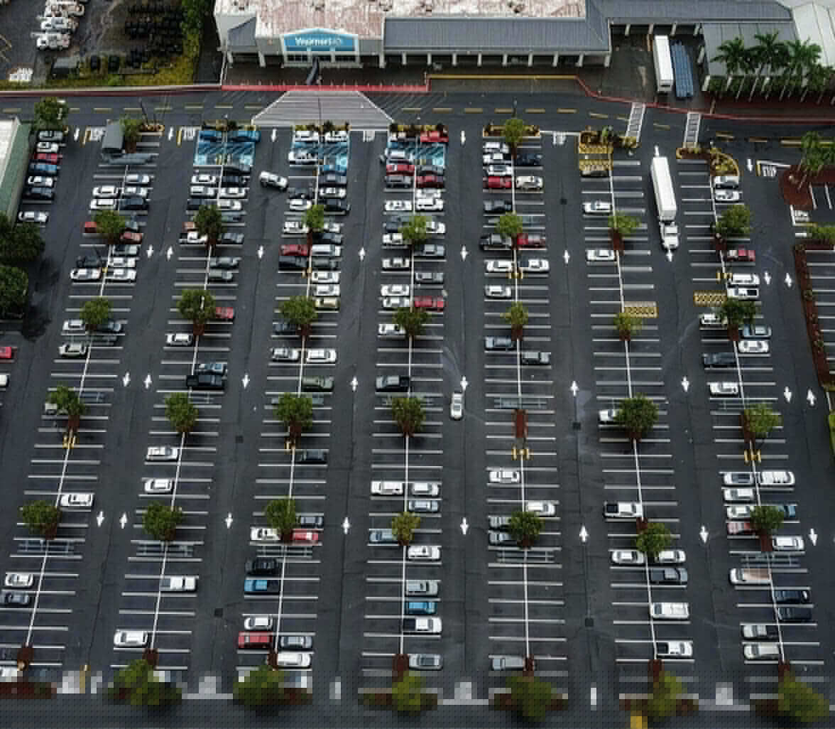aerial view of striped retail parking lot
